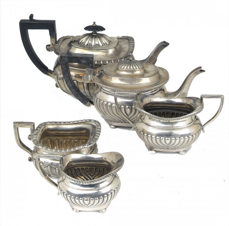 Appraisal: A VICTORIAN LOBED AND FLUTED OBLONG TEAPOT AND MATCHING CREAM