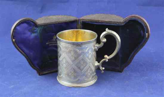 Appraisal: A cased Victorian silver christening mug with engraved geometric lozenge