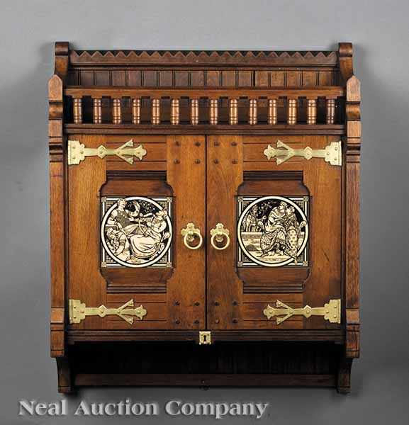 Appraisal: An American Modern Gothic Walnut and Minton Tile Hanging Cabinet