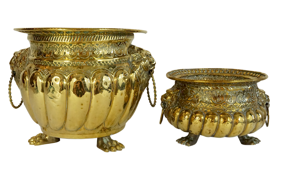 Appraisal: Two Dutch Repousse Jardinieres with Lion Handles and Paw Feet