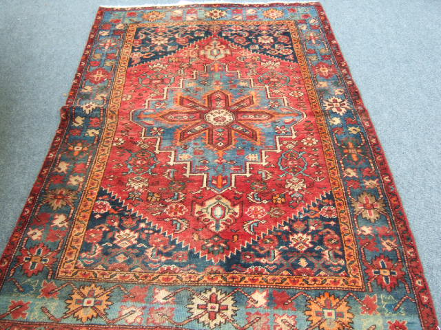 Appraisal: A Hamadan rug Persian the madder field with an indigo