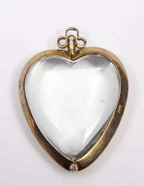 Appraisal: A GOLD MOUNTED HEART SHAPED ROCK CRYSTAL LOCKET long