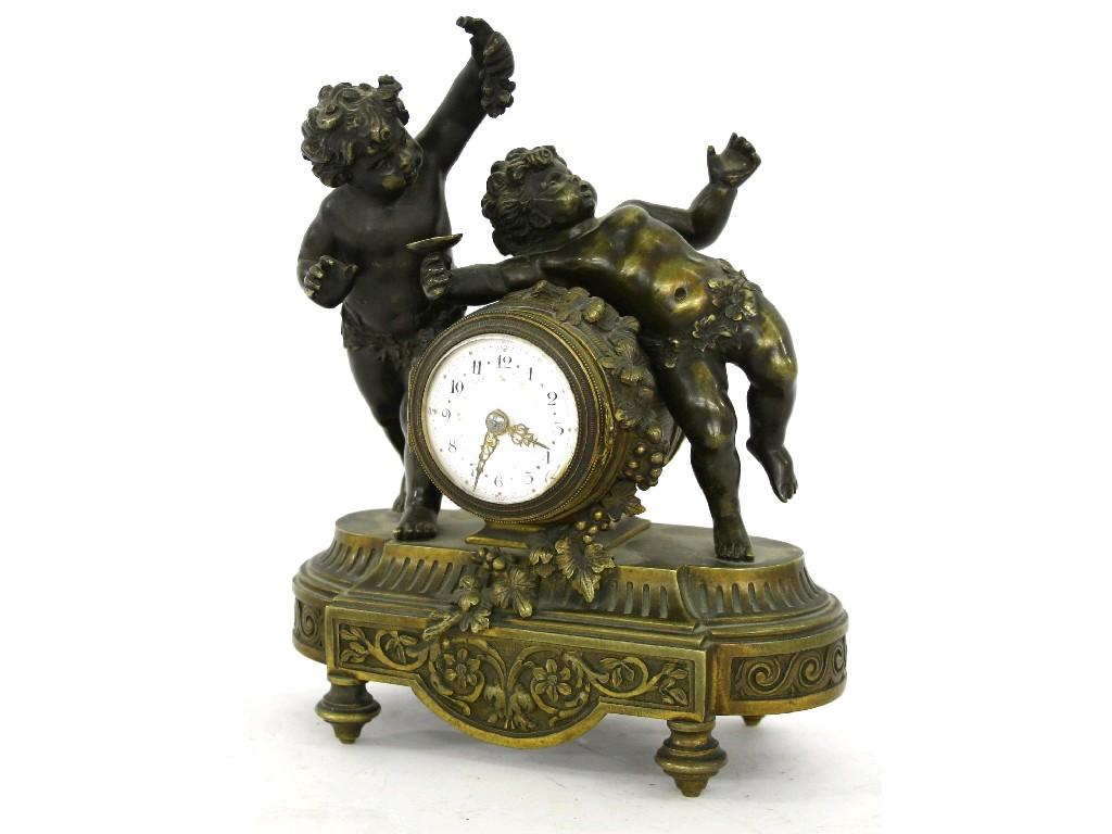 Appraisal: Good small French patinated bronze and ormolu mantel timepiece the