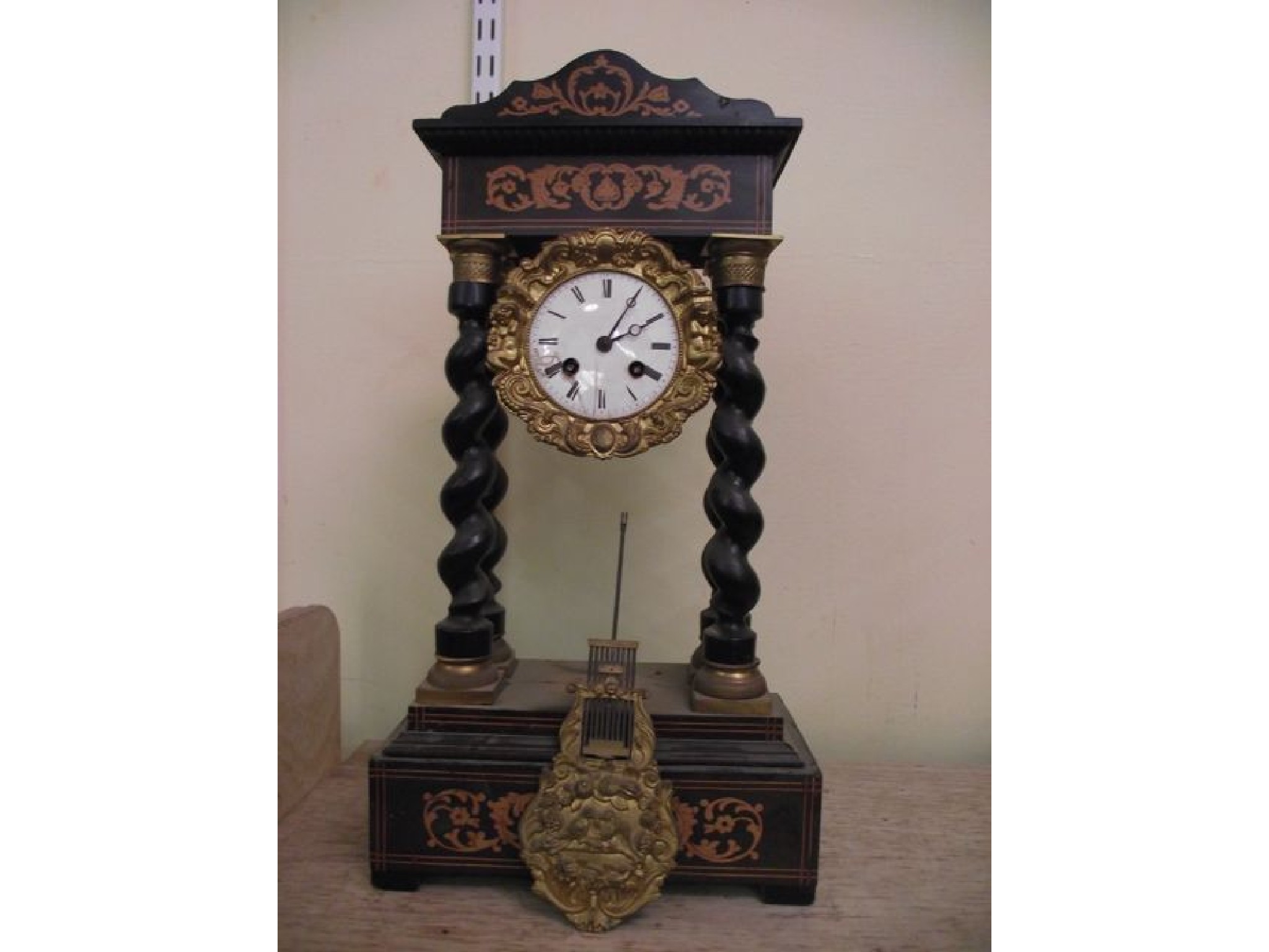 Appraisal: A th century continental portico clock with marquetry inlaid case