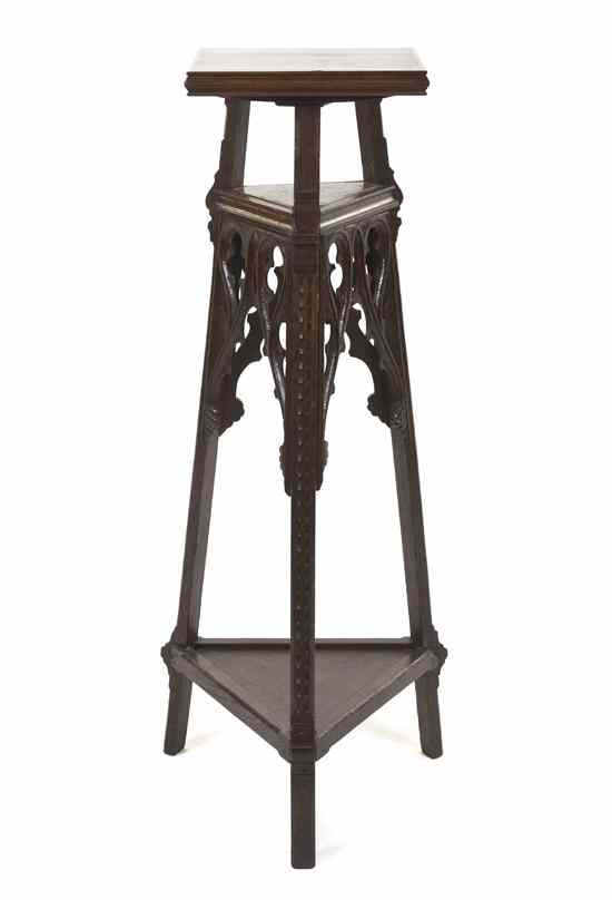 Appraisal: A Gothic Revival Carved Wood Pedestal having a square top