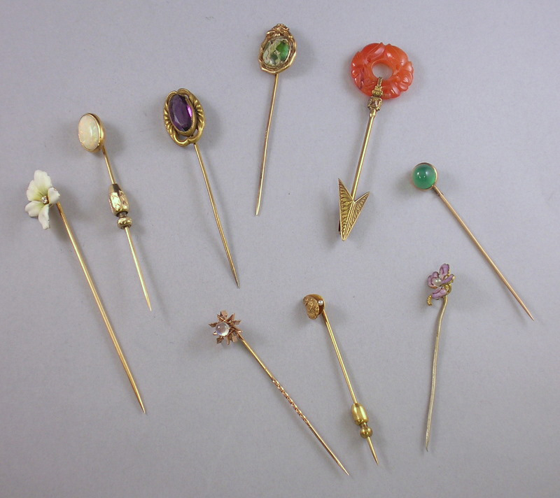 Appraisal: Nine Gold and Gemstone Hardstone and Enamel Stickpins Three pins