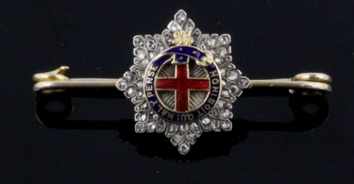 Appraisal: A Coldstream Guards regimental bar brooch with enamel centre to