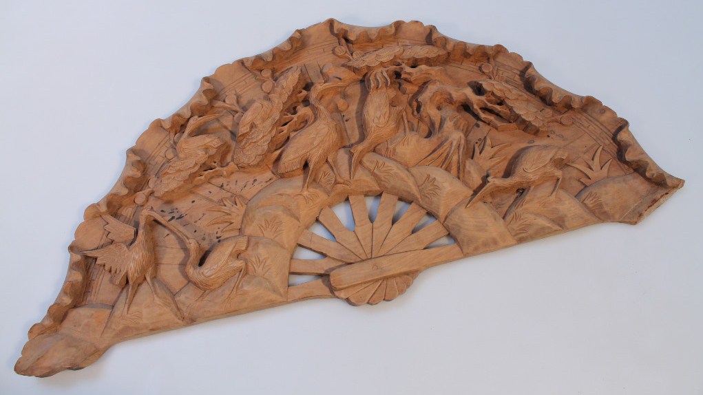 Appraisal: A thC carved wooden plaque in the form of a