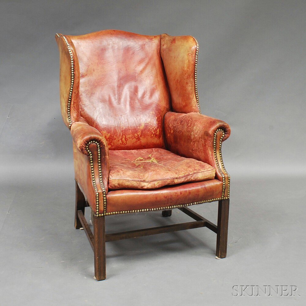 Appraisal: Chippendale-style Leather-upholstered Mahogany Wing Chair the serpentine cresting and shaped