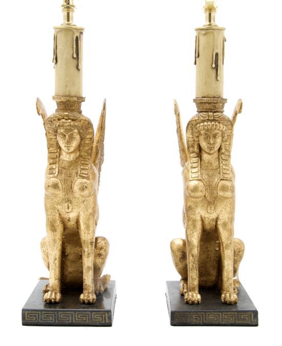 Appraisal: Pair of Empire Style Winged Sphinx of carved and giltwood