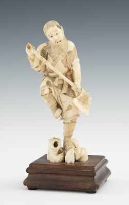 Appraisal: A Carved Ivory Okimono of a Man with an Axe