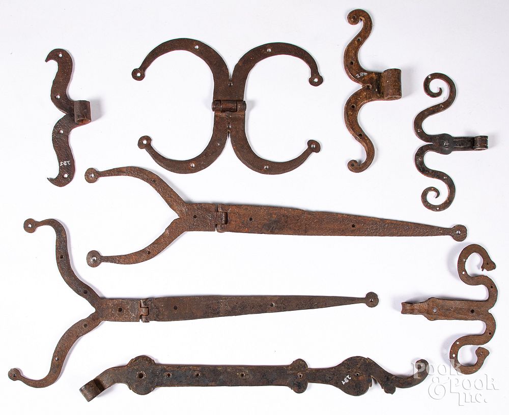 Appraisal: Rams horn and frog leg wrought iron hinges Collection of