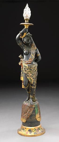 Appraisal: A Venetian polychrome decorated ebonized figural torchere second half th