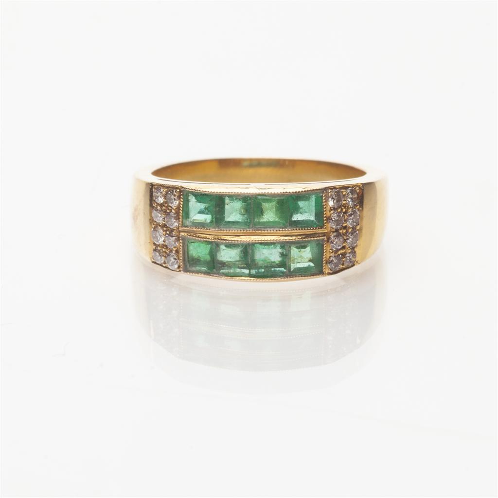 Appraisal: An emerald and diamond set ring channel set in yellow