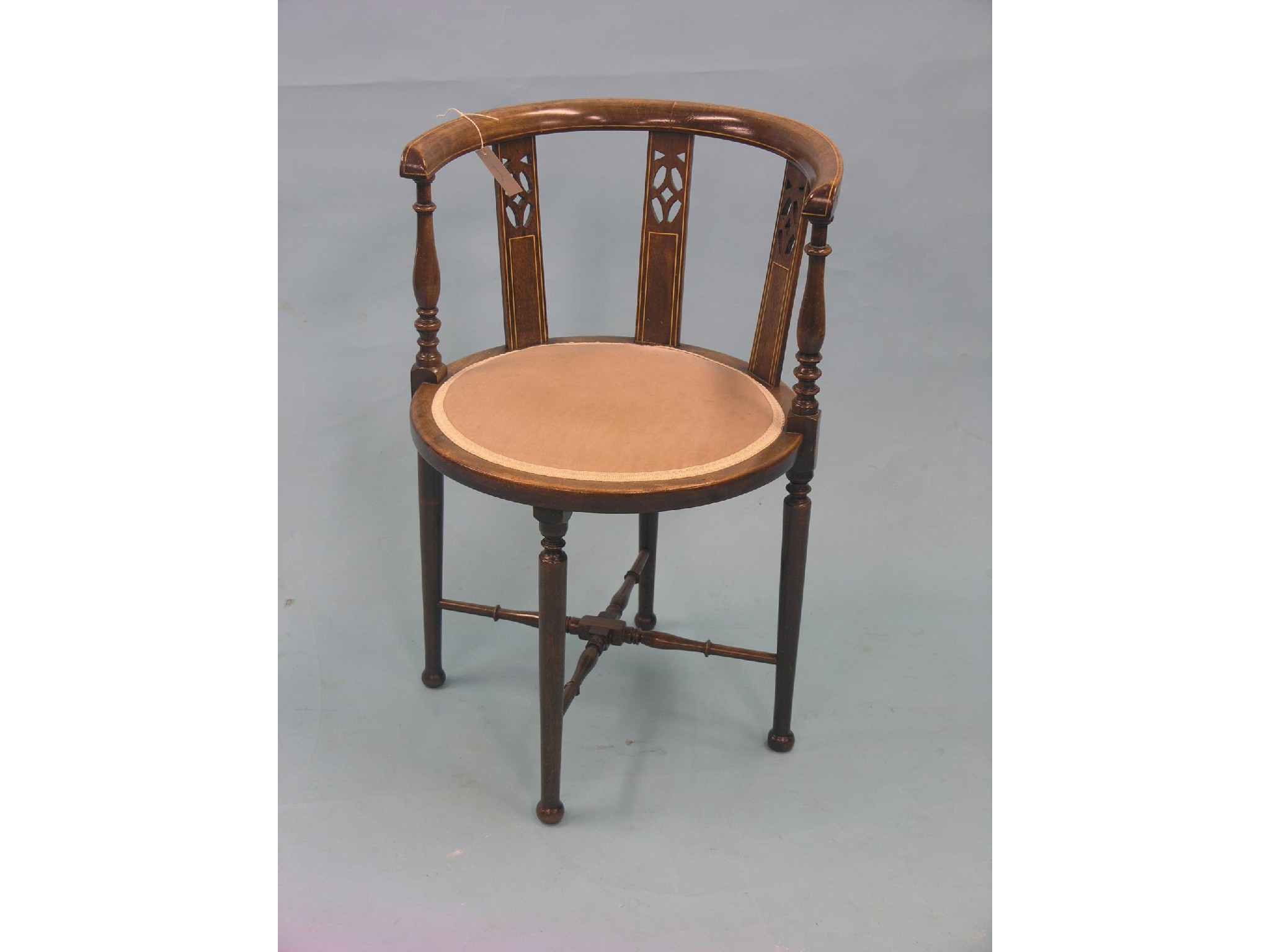 Appraisal: An Edwardian inlaid mahogany elbow chair circular back with pierced