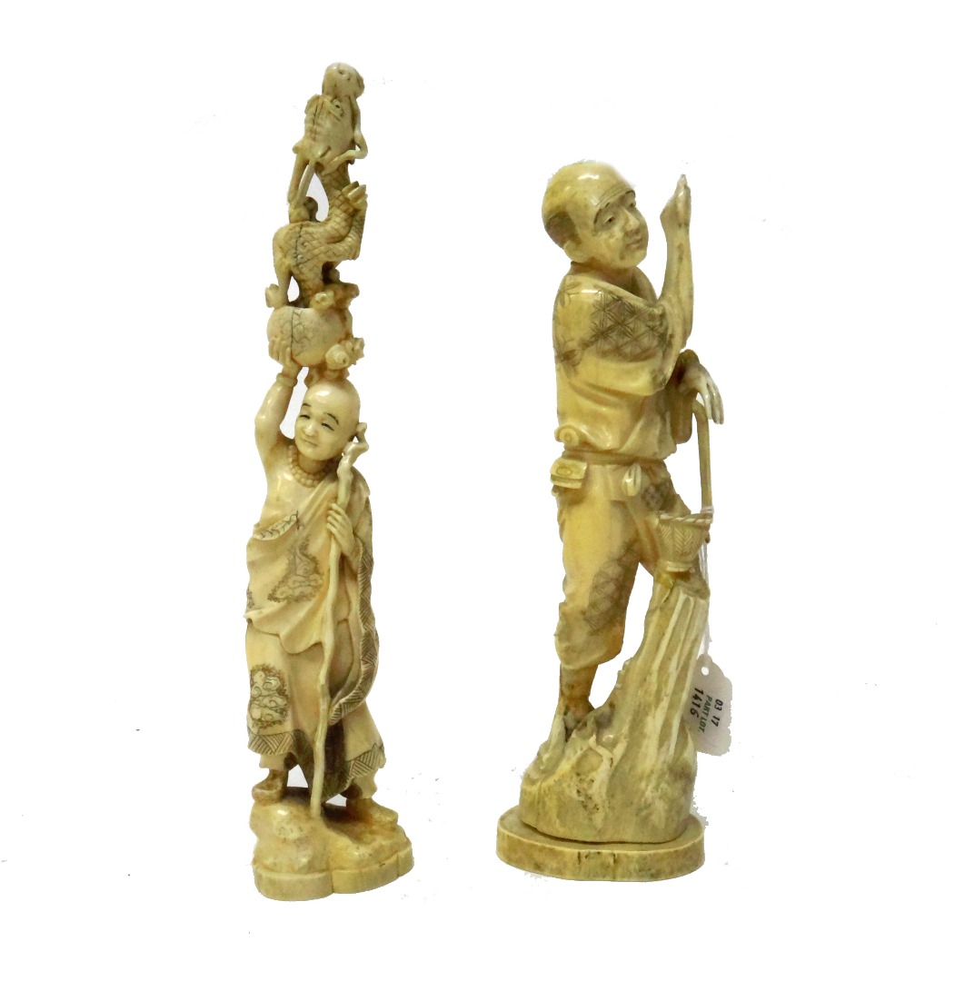 Appraisal: Two Japanese ivory okimono Meiji period the first carved as