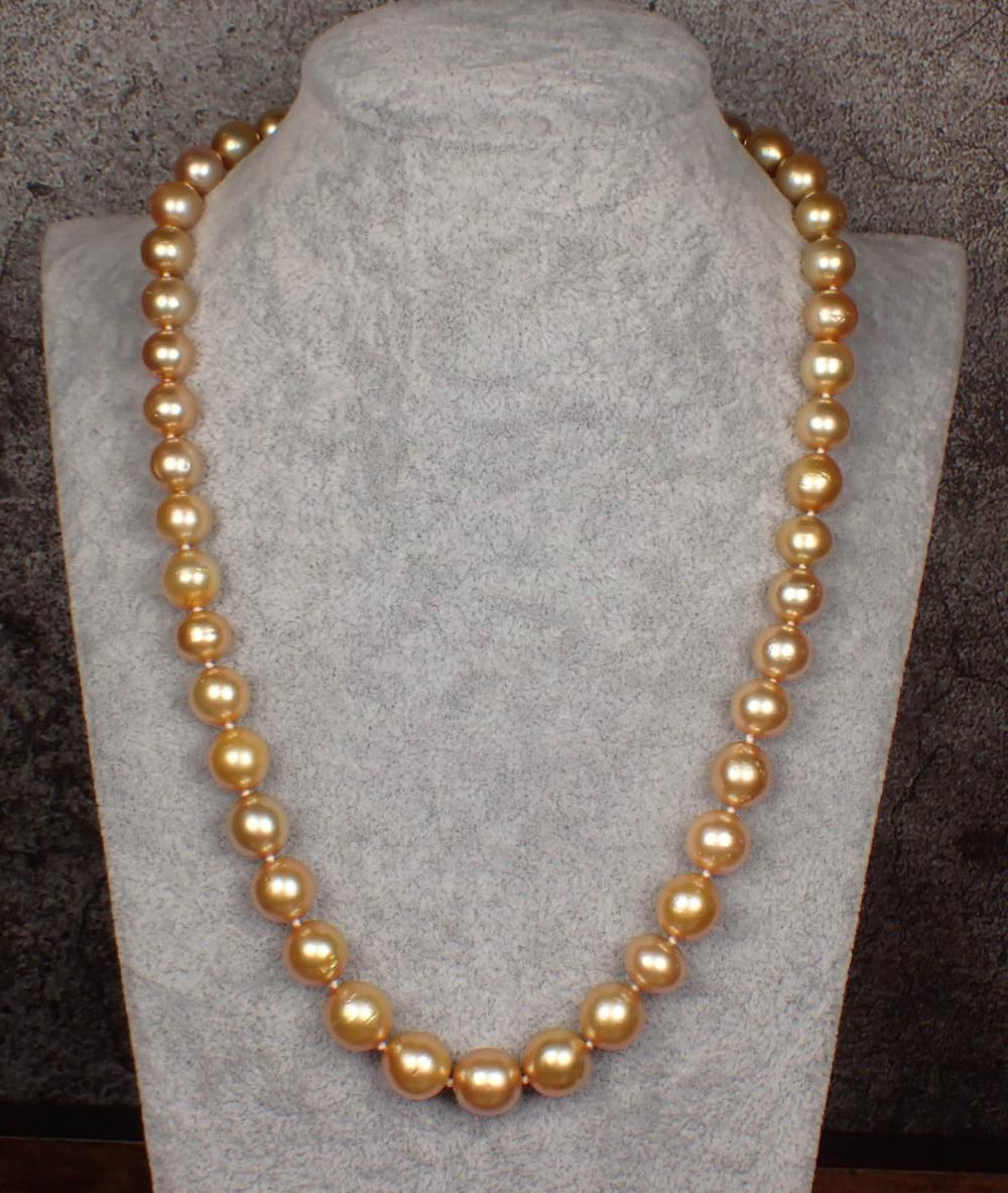 Appraisal: GOLDEN SOUTH SEA PEARL AND FOURTEEN KARAT GOLD NECKLACE hand-knotted