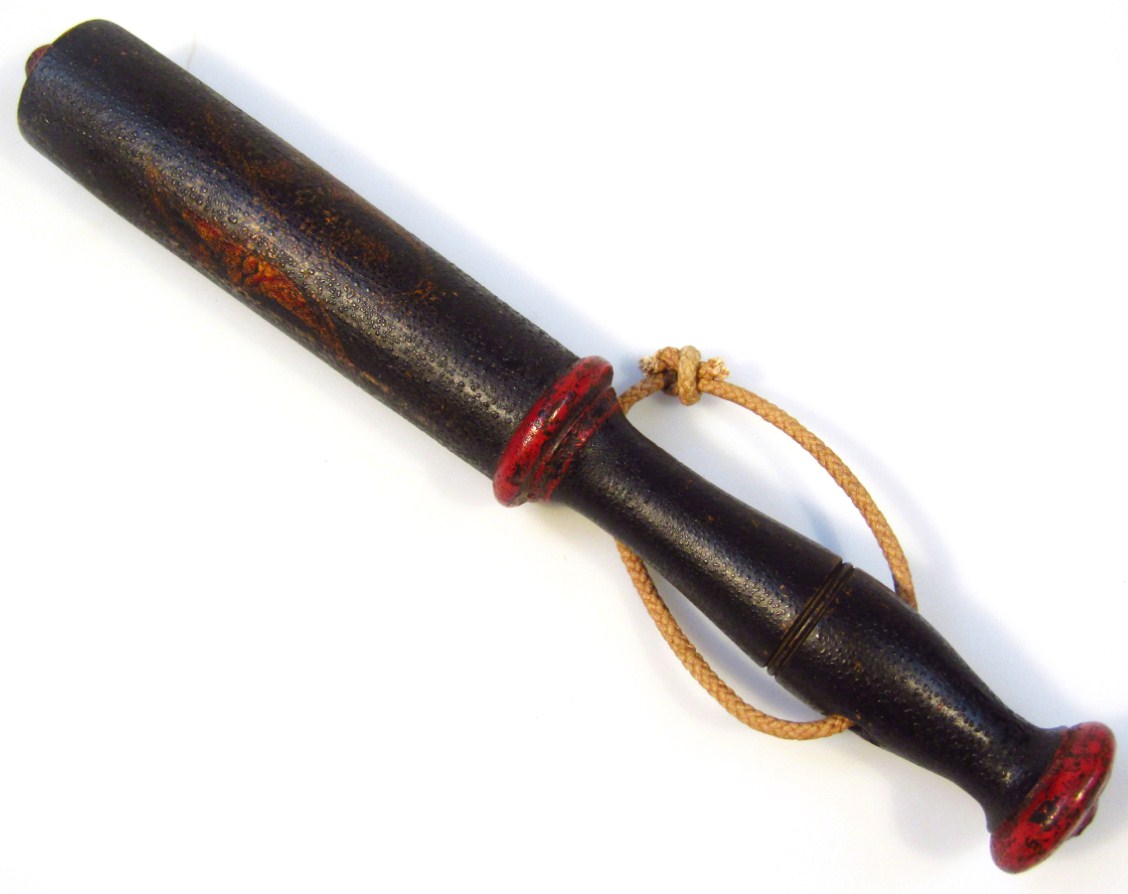 Appraisal: A thC officer's cosh truncheon carved cylindrical outline indistinctly painted