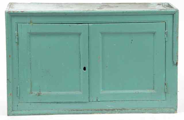 Appraisal: A blue painted pine cupboard fitted drawers cm wide