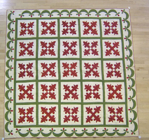 Appraisal: Appliqu quilt th c in a floral grid pattern with