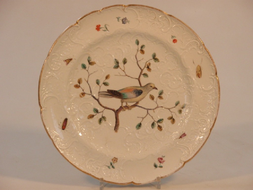 Appraisal: A Marcolini Meissen dessert plate moulded with scrolls and painted