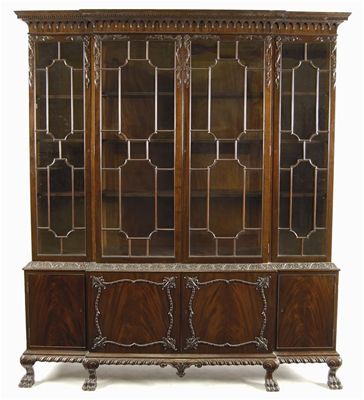 Appraisal: A mahogany breakfront library bookcase by S H Jewell with