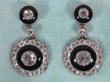 Appraisal: A pair of carat gold and platinum diamond pendant earrings