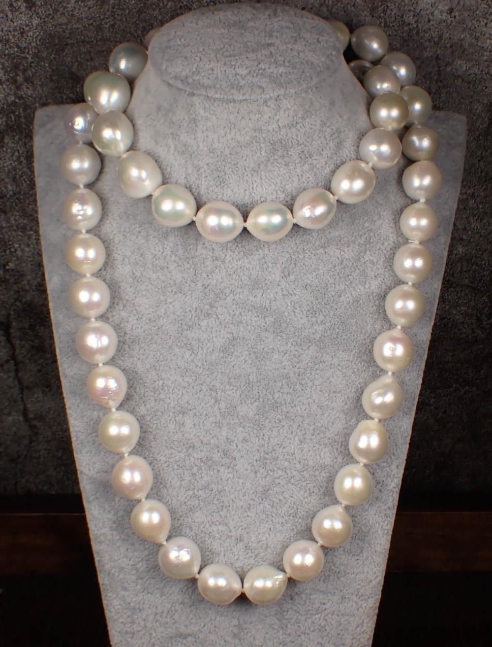 Appraisal: OPERA LENGTH WHITE SOUTH SEA PEARL NECKLACE hand-knotted strand of