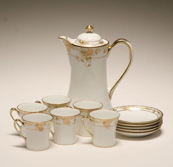 Appraisal: Nippon hand painted and gilt porcelain chocolate set including the