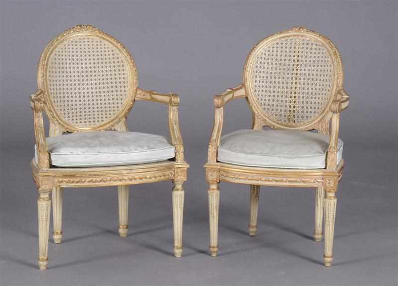 Appraisal: PAIR OF LOUIS XVI STYLE CARVED PAINTED AND PARCEL-GILT CHILD'S