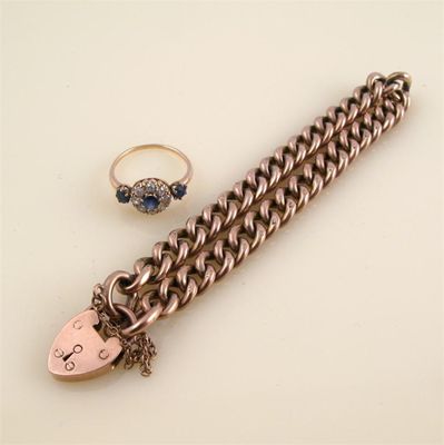 Appraisal: A ct gold curb link bracelet with heart padlock clasp