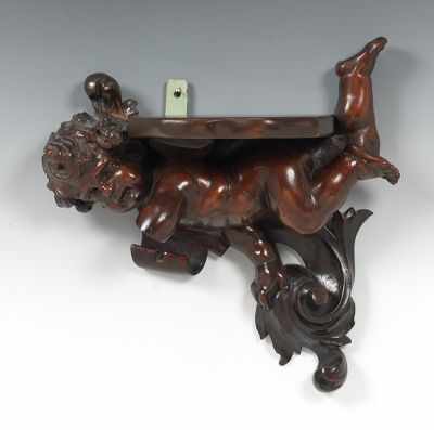 Appraisal: A Carved Wood Cherub Wall Shelf Hand carved wood with