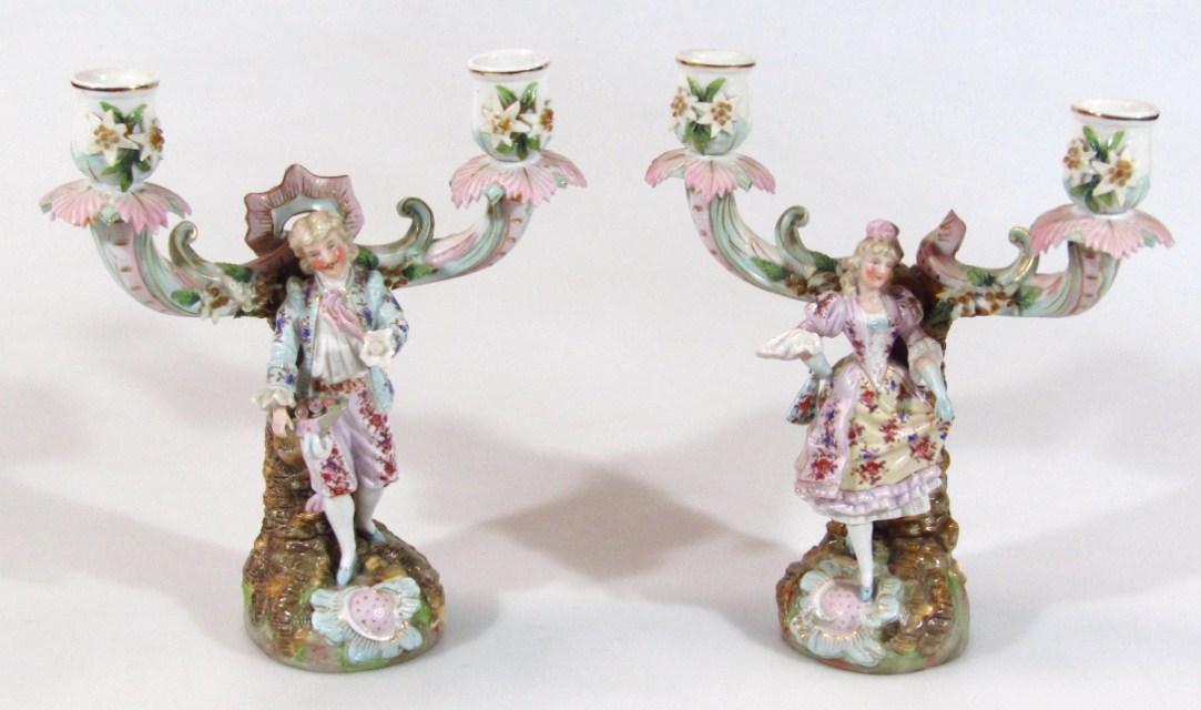 Appraisal: A pair of early thC Dresden style Continental porcelain candlesticks