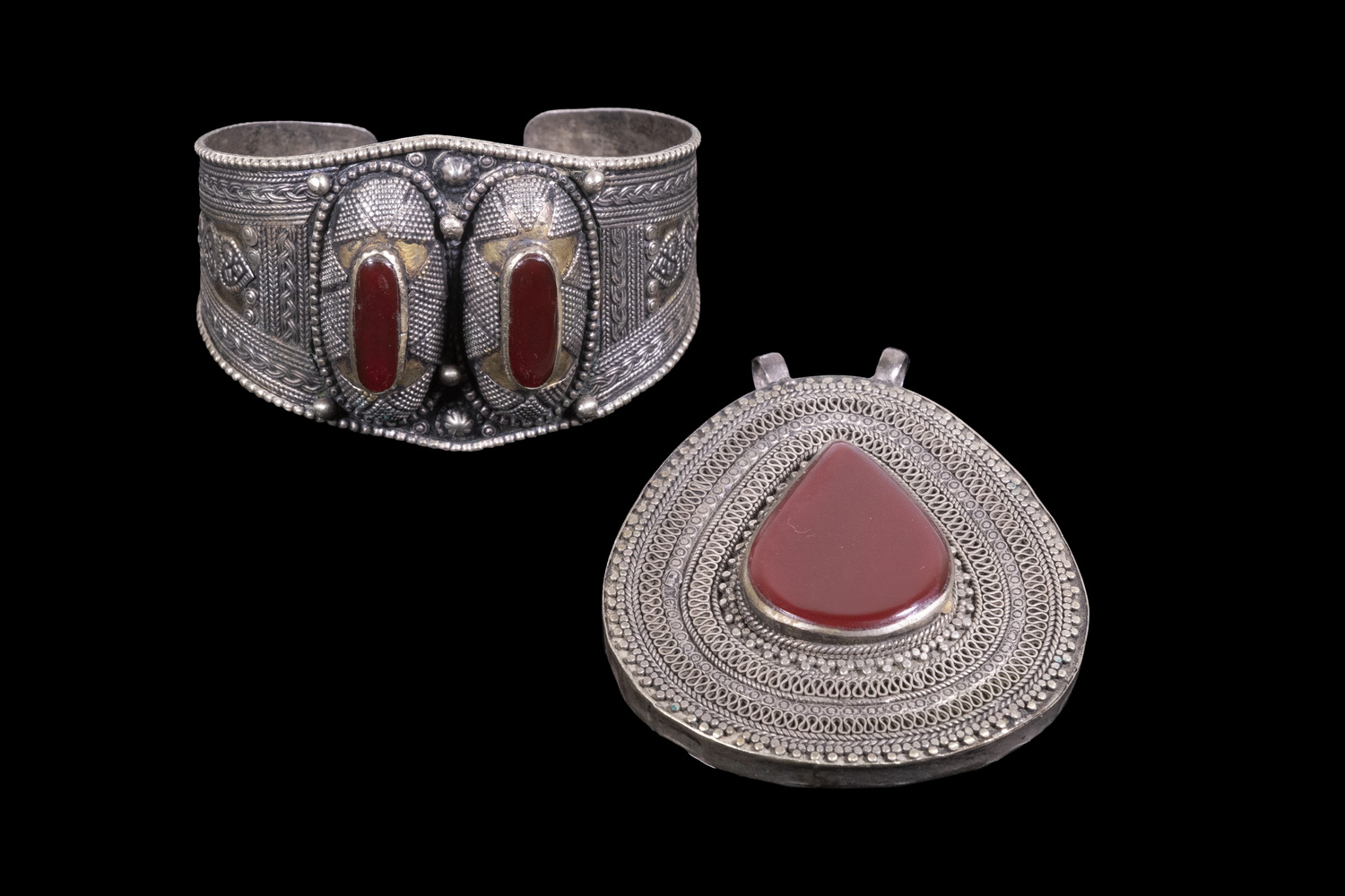 Appraisal: VINTAGE TRIBAL SILVER CUFF BRACELET AND PENDANT Pieces of Alpaca