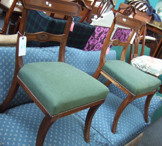 Appraisal: A pair of Regency mahogany dining chairs with reeded crest