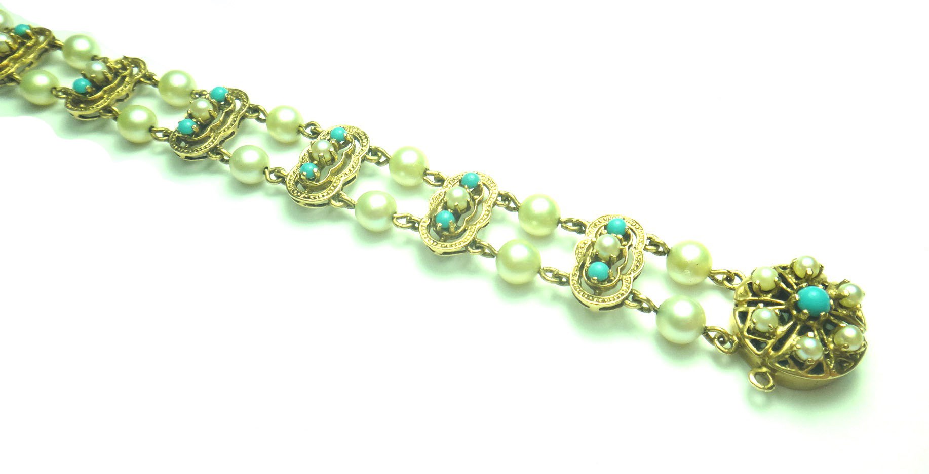 Appraisal: A gold cultured pearl and imitation turquoise set bracelet mounted