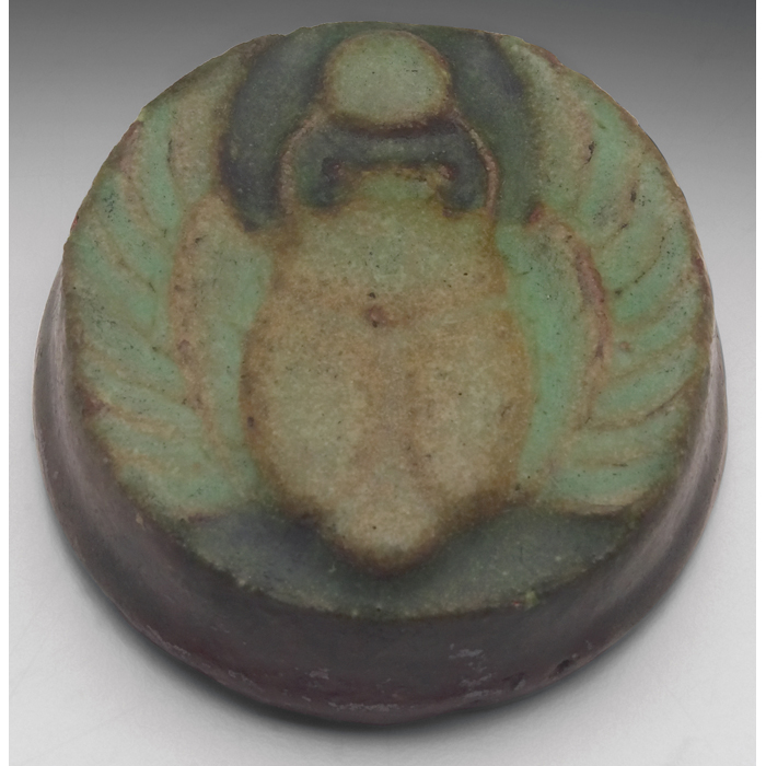 Appraisal: Grueby tile round shape with a carvedand painted scarab design