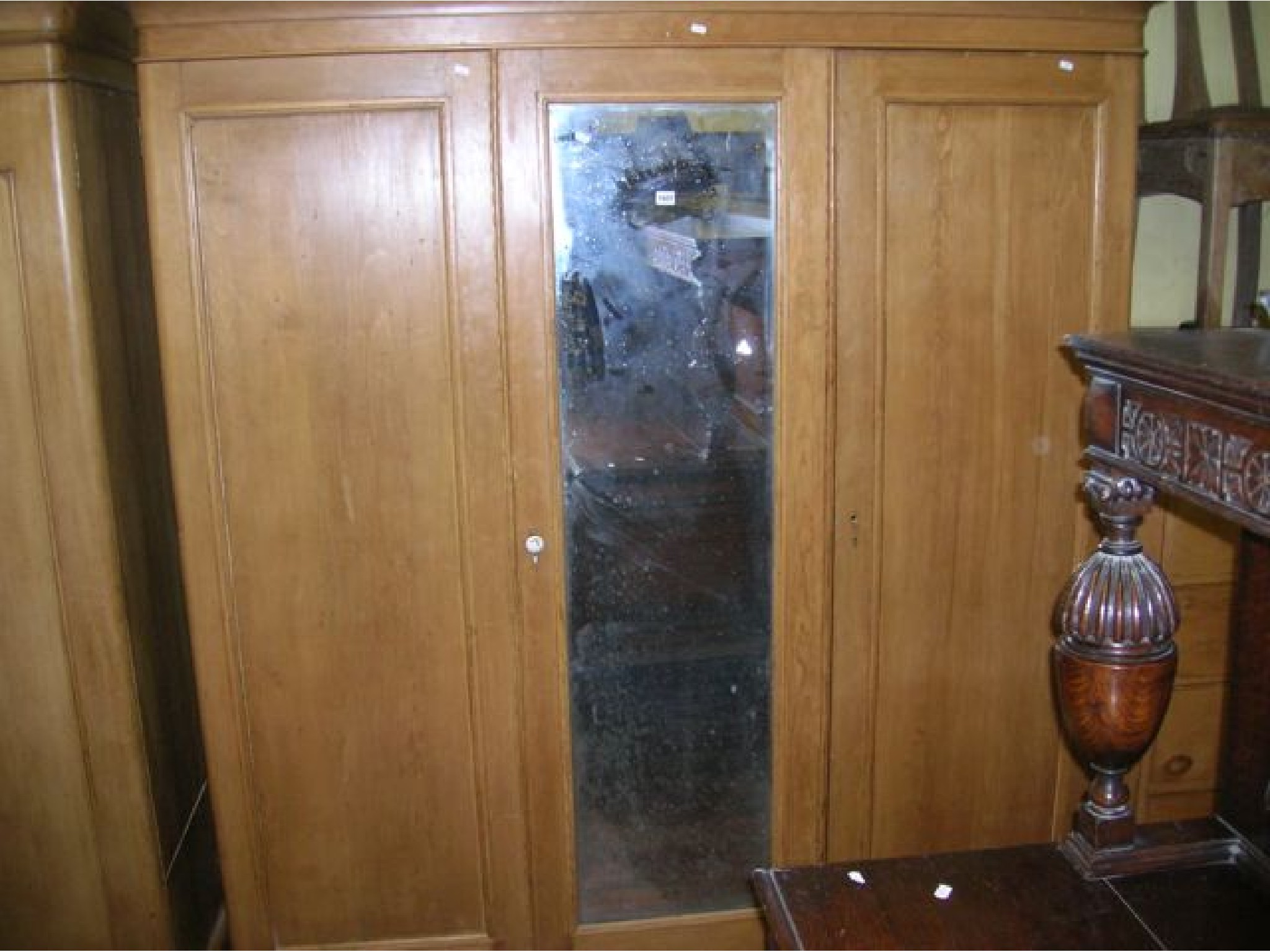 Appraisal: A good Victorian stripped and waxed pine triple wardrobe with