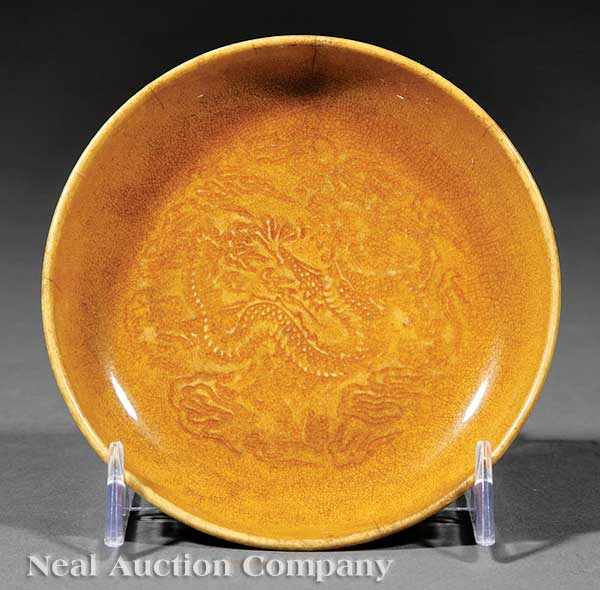 Appraisal: An Antique Chinese Amber Glazed Porcelain Dish the shallow circular