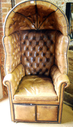 Appraisal: A leather upholstered porter's chair th century the domed top