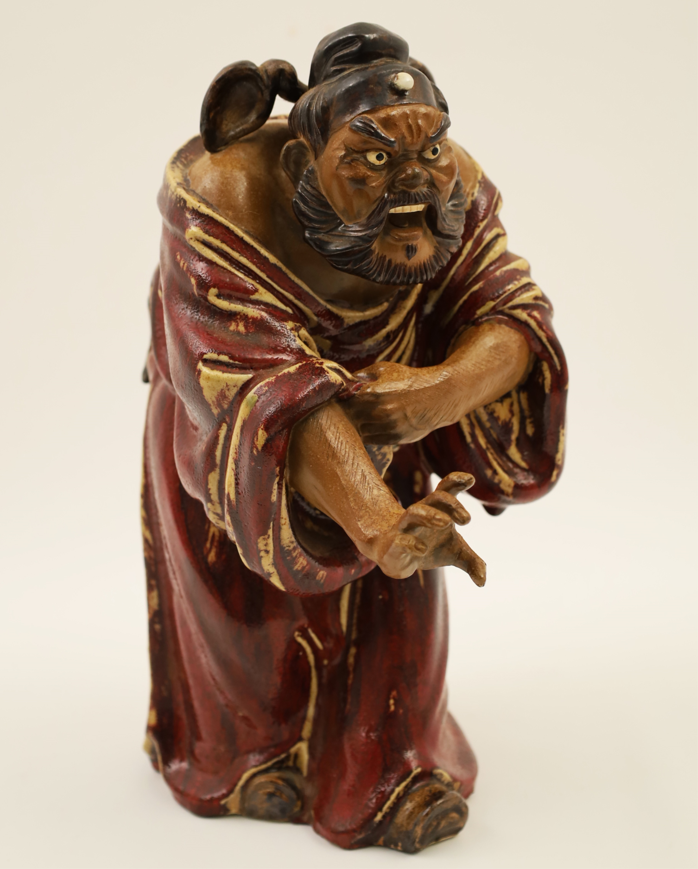 Appraisal: POLYCHROME PLASTER FIGURE OF AN ORIENTAL SAGE Polychrome plaster figure