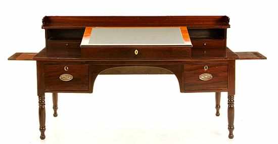 Appraisal: Southern Classical mahogany plantation desk circa shaped gallery above tiered