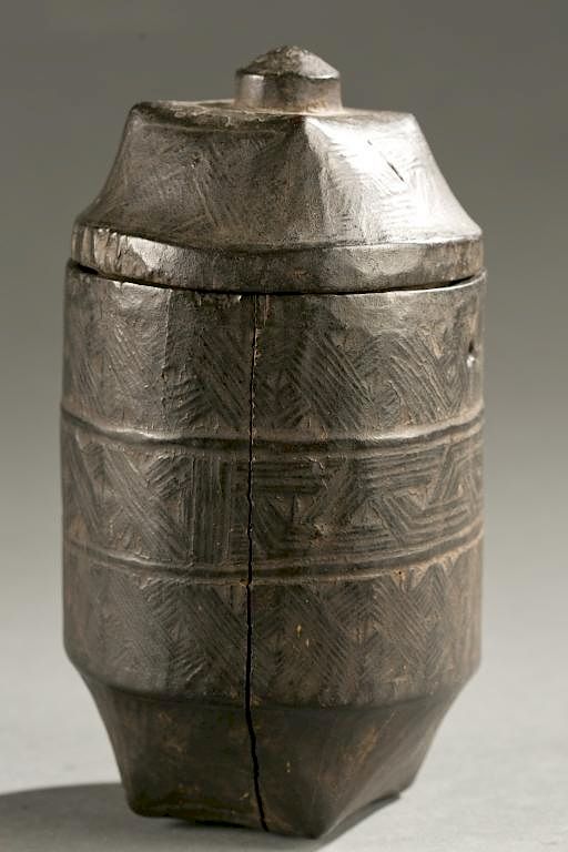 Appraisal: Kuba lidded box th c A lidded incised cylindrical shaped