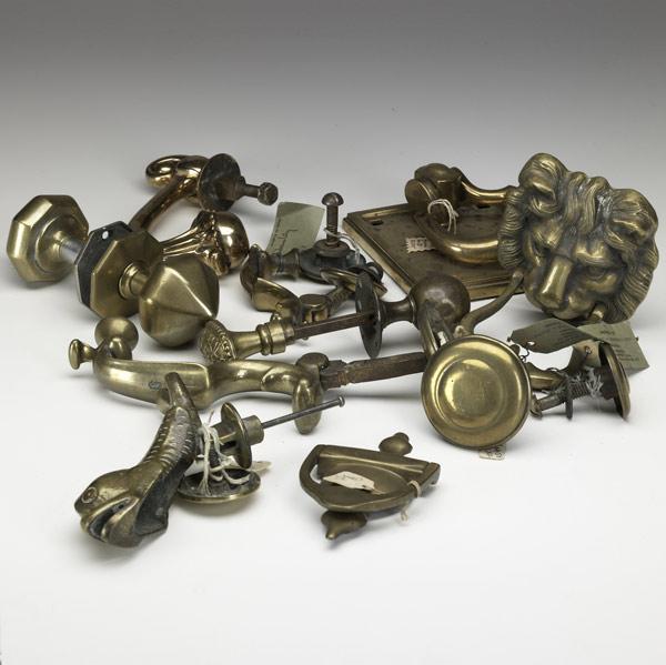 Appraisal: ENGLISH BRASS KNOCKERS AND KNOBS Seven brass knockers include figural