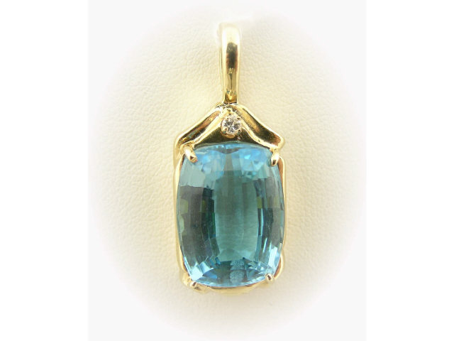 Appraisal: K yellow gold topaz pendant with diamond accent containing one