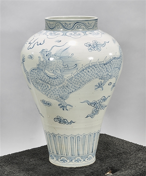 Appraisal: Tall Korean blue and white porcelain vase depicting dragons chasing