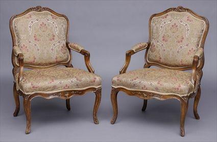 Appraisal: PAIR OF LOUIS XV CARVED WALNUT FAUTEUILS A LA REINE