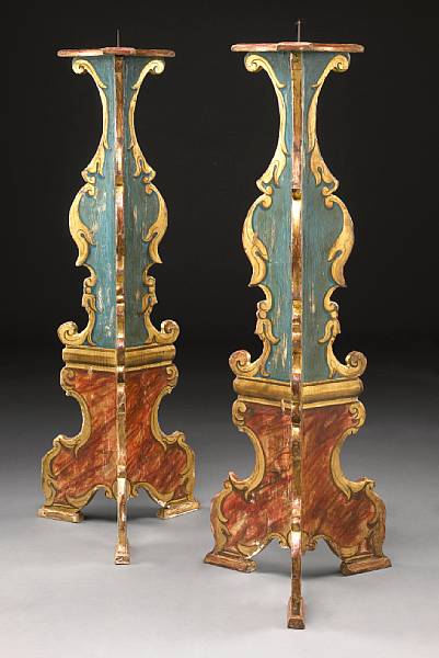 Appraisal: A pair of Italian Baroque style paint decorated prickets th