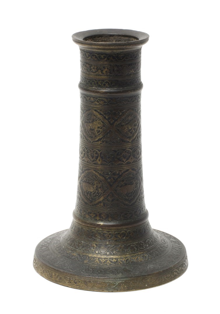 Appraisal: A Safavid engraved bronze candlestick th century cylindrical form on