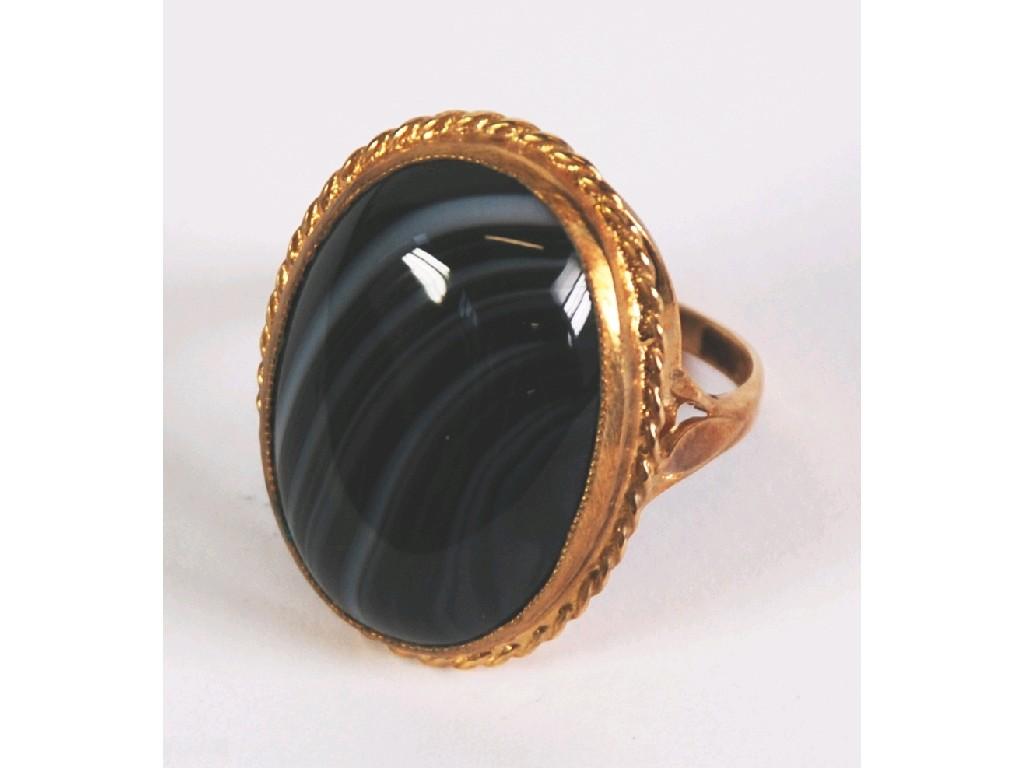 Appraisal: CT GOLD DRESS RING set with a large cabochon oval